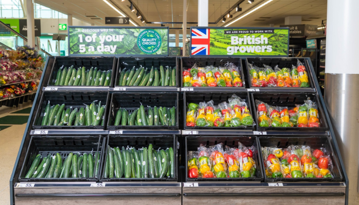 Cucumber and mixed peppers on display in an Asda store
